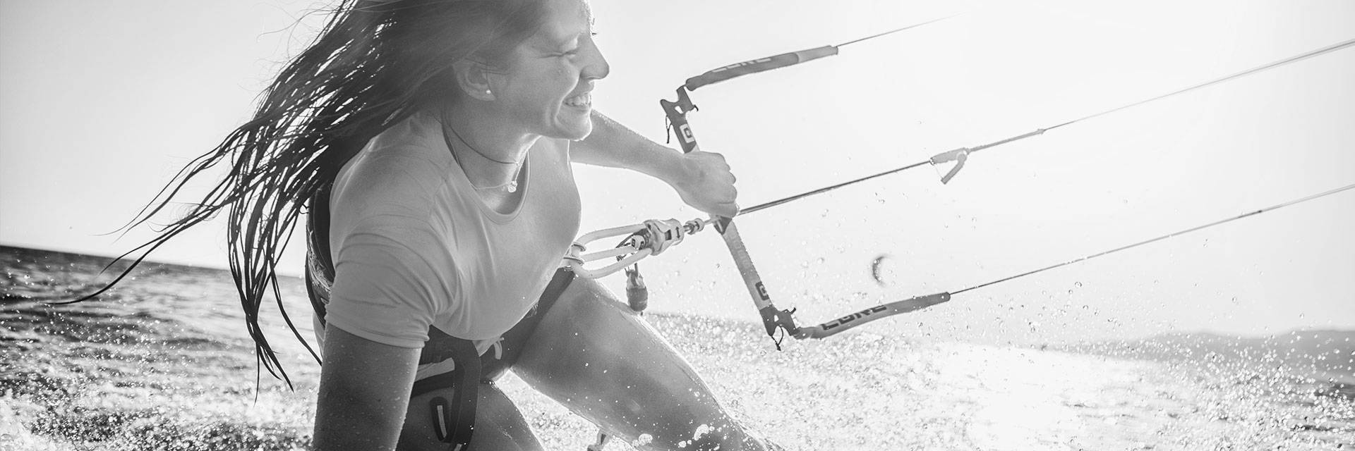 Woman surfing in the sunlight